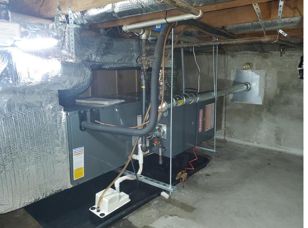 Furnace and air handler installed in a basement with new venting and a condensate pump