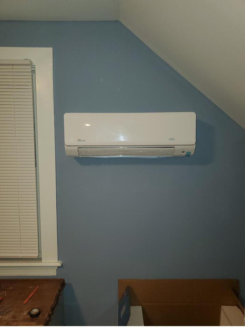 Mini split head unit installed on a bedroom wall